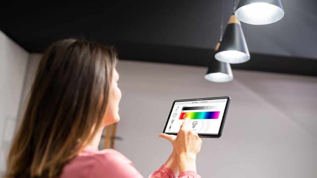 Woman controlling lighting with a smartphone